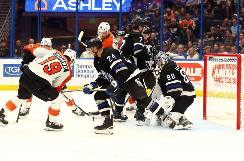 Mar 9, 2024; Tampa, Florida, USA; Philadelphia Flyers right wing Garnet Hathaway (19) shoots as Tampa Bay Lightning goaltender Andrei Vasilevskiy (88) defends during the second period at Amalie Arena. Mandatory Credit: Kim Klement Neitzel-USA TODAY Sports