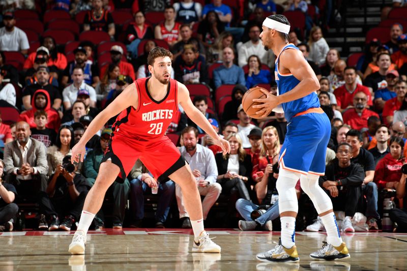 HOUSTON, TX - NOVEMBER 4: Alperen Sengun #28 of the Houston Rockets plays defense during the game against the New York Knicks on November 4, 2024 at the Toyota Center in Houston, Texas. NOTE TO USER: User expressly acknowledges and agrees that, by downloading and or using this photograph, User is consenting to the terms and conditions of the Getty Images License Agreement. Mandatory Copyright Notice: Copyright 2024 NBAE (Photo by Logan Riely/NBAE via Getty Images)