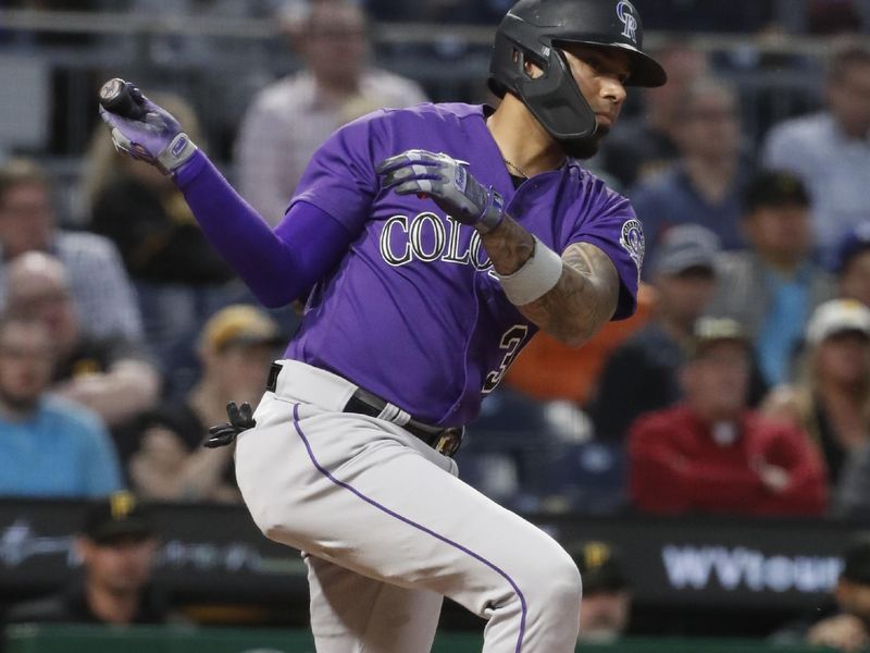 May 9, 2023; Pittsburgh, Pennsylvania, USA;  Colorado Rockies second baseman Harold Castro (30) hits a double against the Pittsburgh Pirates during the seventh inning at PNC Park. Mandatory Credit: Charles LeClaire-USA TODAY Sports