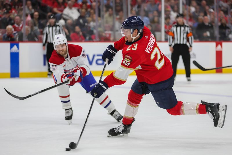 Feb 29, 2024; Sunrise, Florida, USA; Florida Panthers center Carter Verhaeghe (23) shoots the puck against the Montreal Canadiens during the second period at Amerant Bank Arena. Mandatory Credit: Sam Navarro-USA TODAY Sports