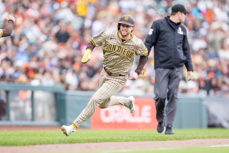 Sep 15, 2024; San Francisco, California, USA;  San Diego Padres first base Jake Cronenworth (9) comes around to score during the tenth inning against the San Francisco Giants at Oracle Park. Mandatory Credit: Bob Kupbens-Imagn Images