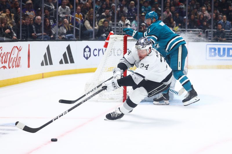 Dec 27, 2023; Los Angeles, California, USA; Los Angeles Kings right wing Arthur Kaliyev (34) skates towards the puck during the second period of a game against the San Jose Sharks at Crypto.com Arena. Mandatory Credit: Jessica Alcheh-USA TODAY Sports