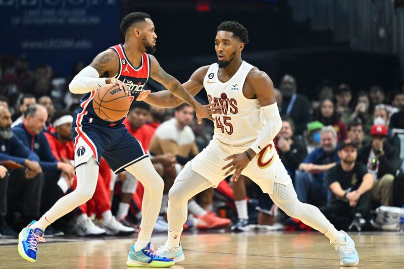 CLEVELAND, OHIO - OCTOBER 23: Monte Morris #22 of the Washington Wizards looks to pass under pressure from Donovan Mitchell #45 of the Cleveland Cavaliers during the second quarter at Rocket Mortgage Fieldhouse on October 23, 2022 in Cleveland, Ohio. NOTE TO USER: User expressly acknowledges and agrees that, by downloading and or using this photograph, User is consenting to the terms and conditions of the Getty Images License Agreement. (Photo by Jason Miller/Getty Images)