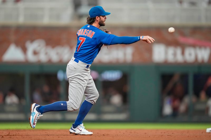 Sep 27, 2023; Cumberland, Georgia, USA; Chicago Cubs shortstop Dansby Swanson (7) throws out Atlanta Braves third baseman Austin Riley (27) (not shown) during the first inning at Truist Park. Mandatory Credit: Dale Zanine-USA TODAY Sports