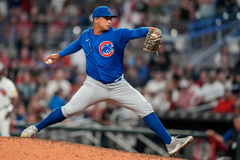 Sep 27, 2023; Cumberland, Georgia, USA; Chicago Cubs relief pitcher Daniel Palencia (48) pitches against the Atlanta Braves during the tenth inning at Truist Park. Mandatory Credit: Dale Zanine-USA TODAY Sports