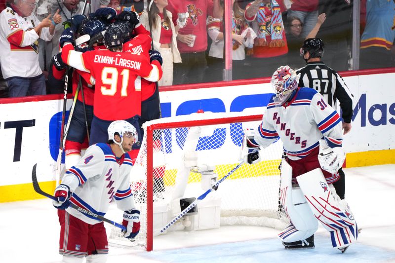 Jun 1, 2024; Sunrise, Florida, USA; Florida Panthers right wing Vladimir Tarasenko (10) celebrates a goal with teammates during the third period as New York Rangers goaltender Igor Shesterkin (31) looks on in game six of the Eastern Conference Final of the 2024 Stanley Cup Playoffs at Amerant Bank Arena. Mandatory Credit: Jim Rassol-USA TODAY Sports