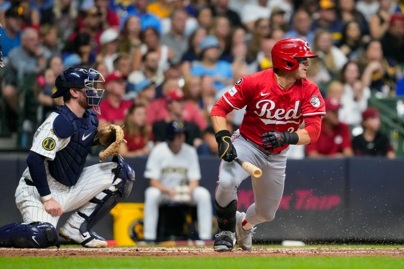 Sep 27, 2025; Milwaukee, Wisconsin, USA;  Cincinnati Reds center fielder TJ Friedl (29) hits an RBI single during the third inning against the Milwaukee Brewers at American Family Field. Mandatory Credit: Jeff Hanisch-Imagn Images