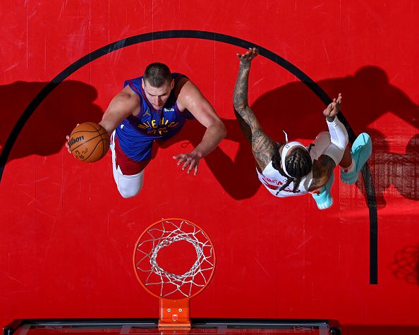 TORONTO, CANADA - DECEMBER 20: Nikola Jokic #15 of the Denver Nuggets drives to the basket during the game against the Toronto Raptors on December 20, 2023 at the Scotiabank Arena in Toronto, Ontario, Canada.  NOTE TO USER: User expressly acknowledges and agrees that, by downloading and or using this Photograph, user is consenting to the terms and conditions of the Getty Images License Agreement.  Mandatory Copyright Notice: Copyright 2023 NBAE (Photo by Vaughn Ridley/NBAE via Getty Images)