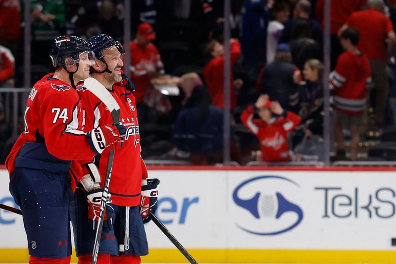 Nov 26, 2025; Washington, District of Columbia, USA; Washington Capitals defenseman John Carlson (74) and Capitals left wing Alex Ovechkin (8) celebrate after their game against the Winnipeg Jets at Capital One Arena. Mandatory Credit: Geoff Burke-Imagn Images