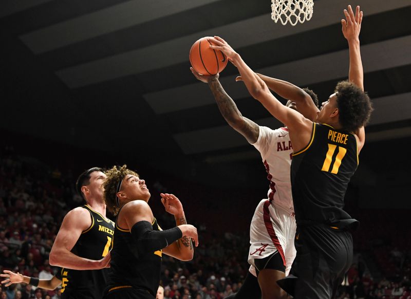 Jan 16, 2024; Tuscaloosa, Alabama, USA; Missouri forward Trent Pierce (11) blocks a shot by Alabama guard Rylan Griffen (3) at Coleman Coliseum. Mandatory Credit: Gary Cosby Jr.-USA TODAY Sports