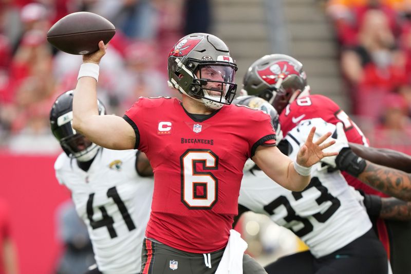 Tampa Bay Buccaneers quarterback Baker Mayfield (6) makes a pass attempt during an NFL football game against the Jacksonville Jaguars, Sunday, Dec. 24, 2023, in Tampa, Fla. (AP Photo/Peter Joneleit)