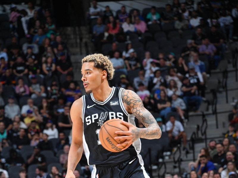 SAN ANTONIO, TX - MARCH 29: Jeremy Sochan #10 of the San Antonio Spurs handles the ball during the game against the New York Knicks on March 29, 2024 at the Frost Bank Center in San Antonio, Texas. NOTE TO USER: User expressly acknowledges and agrees that, by downloading and or using this photograph, user is consenting to the terms and conditions of the Getty Images License Agreement. Mandatory Copyright Notice: Copyright 2024 NBAE (Photos by Michael Gonzales/NBAE via Getty Images)