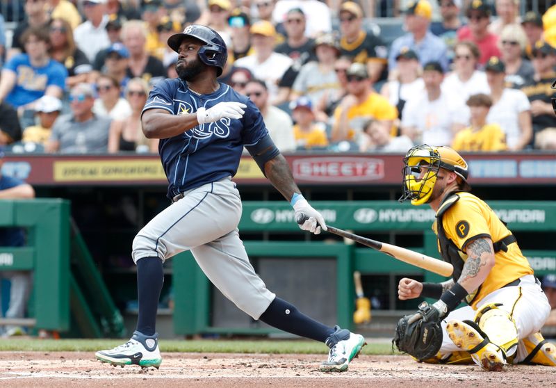 Jun 23, 2024; Pittsburgh, Pennsylvania, USA;  Tampa Bay Rays left fielder Randy Arozarena (56) hits a single against the Pittsburgh Pirates during the third inning at PNC Park. Mandatory Credit: Charles LeClaire-USA TODAY Sports