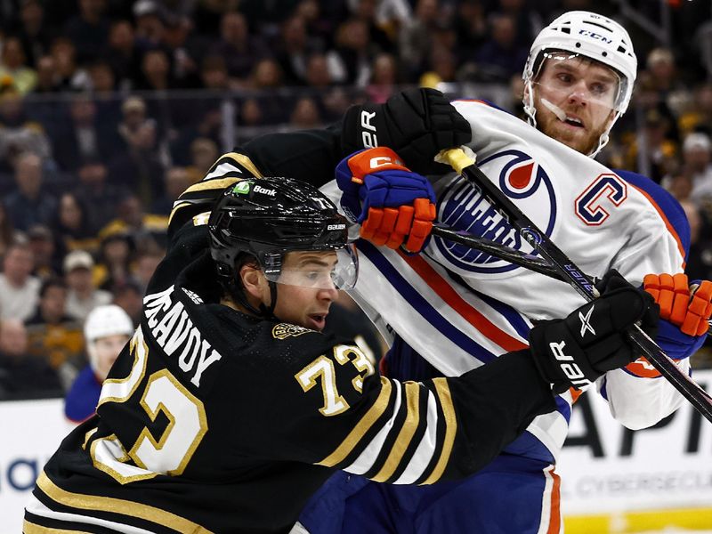 Mar 5, 2024; Boston, Massachusetts, USA; Boston Bruins defenseman Charlie McAvoy (73) stands up Edmonton Oilers center Connor McDavid (97) during the first period at TD Garden. Mandatory Credit: Winslow Townson-USA TODAY Sports