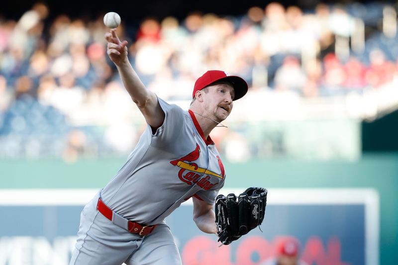 May 9, 2025; Washington, District of Columbia, USA;  St. Louis Cardinals starting pitcher Erick Fedde (12) pitches against the Washington Nationals during the first inning at Nationals Park. Mandatory Credit: Geoff Burke-Imagn Images