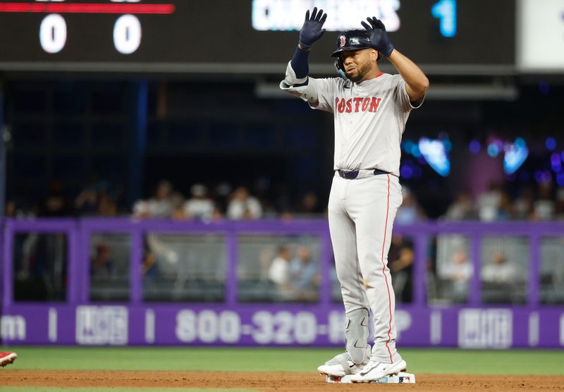 Jul 2, 2024; Miami, Florida, USA;  Boston Red Sox first baseman Dominic Smith (2) reacts to his double against the Miami Marlins in the sixth inning at loanDepot Park. Mandatory Credit: Rhona Wise-USA TODAY Sports