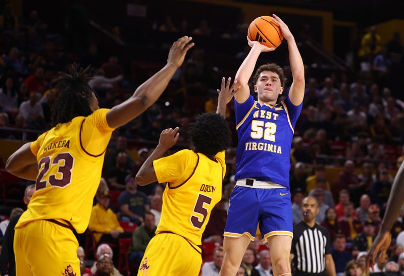 Jan 21, 2026; Tempe, Arizona, USA; West Virginia Mountaineers forward Treysen Eaglestaff (52) against the Arizona State Sun Devils in the first half at Desert Financial Arena. Mandatory Credit: Mark J. Rebilas-Imagn Images