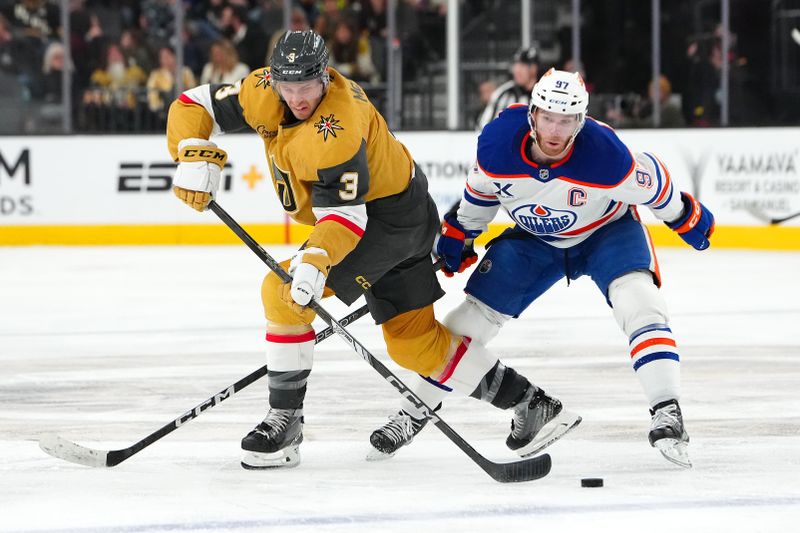 Dec 3, 2024; Las Vegas, Nevada, USA; Vegas Golden Knights defenseman Brayden McNabb (3) clears the puck away from Edmonton Oilers center Connor McDavid (97) during the third period at T-Mobile Arena. Mandatory Credit: Stephen R. Sylvanie-Imagn Images