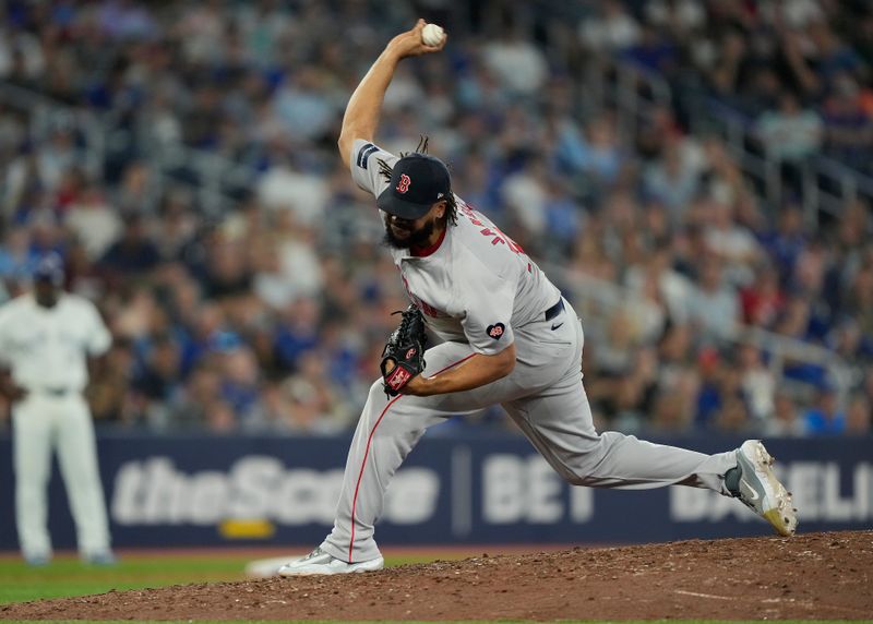 Jun 18, 2024; Toronto, Ontario, CAN; Boston Red Sox pitcher Kenley Jansen (74) pitches to the Toronto Blue Jays during the ninth inning at Rogers Centre. Mandatory Credit: John E. Sokolowski-USA TODAY Sports