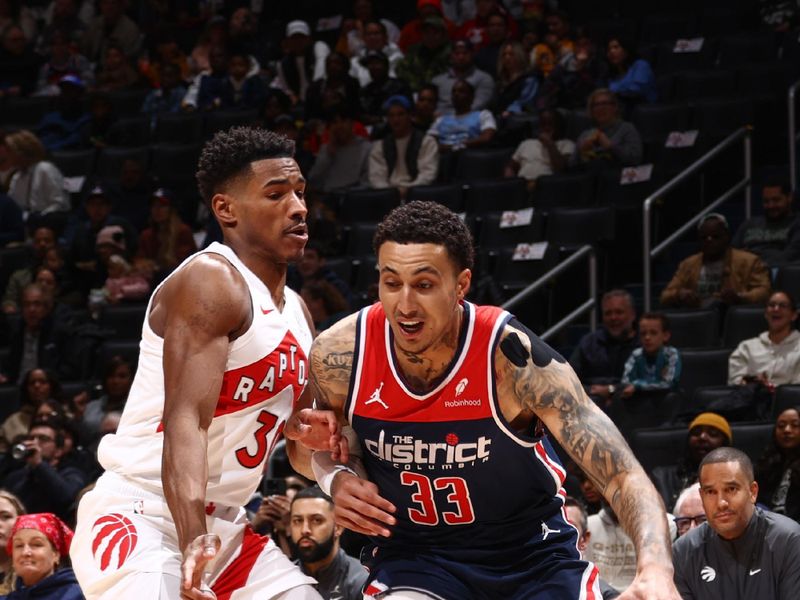 WASHINGTON, DC -? MARCH 23:  Ochai Agbaji #30 of the Toronto Raptors plays defense during the game  against Kyle Kuzma #33 of the Washington Wizards on March 23, 2024 at Capital One Arena in Washington, DC. NOTE TO USER: User expressly acknowledges and agrees that, by downloading and or using this Photograph, user is consenting to the terms and conditions of the Getty Images License Agreement. Mandatory Copyright Notice: Copyright 2024 NBAE (Photo by Kenny Giarla/NBAE via Getty Images)