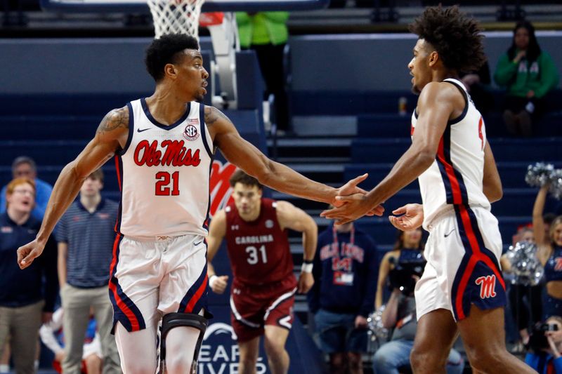 Feb 11, 2023; Oxford, Mississippi, USA; Mississippi Rebels forward Robert Allen (21) reacts with forward Jaemyn Brakefield (4) after a basket during the first half against the South Carolina Gamecocks at The Sandy and John Black Pavilion at Ole Miss. Mandatory Credit: Petre Thomas-USA TODAY Sports