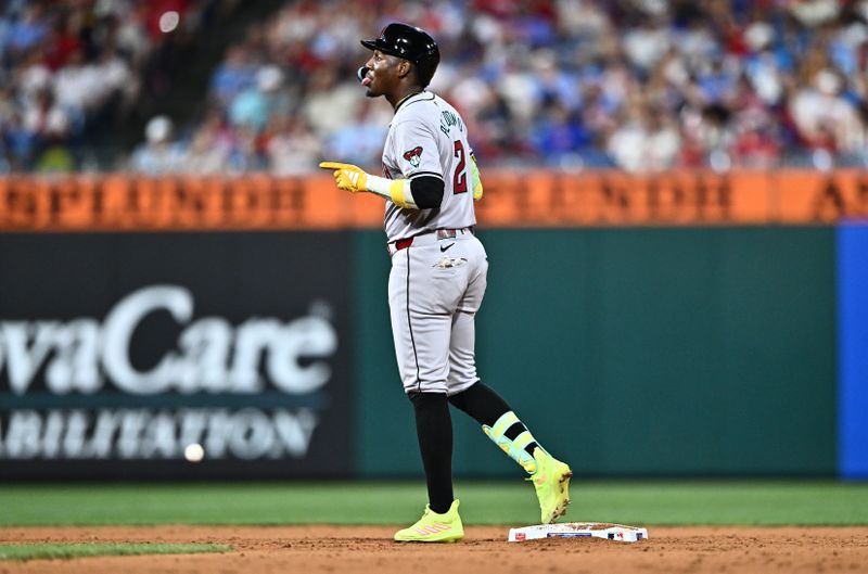 Jun 21, 2024; Philadelphia, Pennsylvania, USA; Arizona Diamondbacks infielder Geraldo Perdomo (2) reacts after hitting an RBI single and advancing to second against the Philadelphia Phillies in the eighth inning at Citizens Bank Park. Mandatory Credit: Kyle Ross-USA TODAY Sports