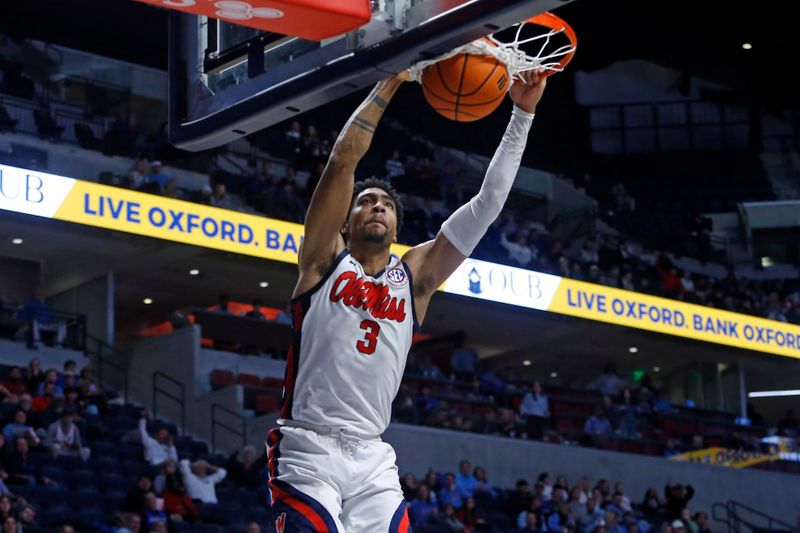 Jan 31, 2023; Oxford, Mississippi, USA; Mississippi Rebels forward Myles Burns (3) dunks during the second half against the Kentucky Wildcats at The Sandy and John Black Pavilion at Ole Miss. Mandatory Credit: Petre Thomas-USA TODAY Sports