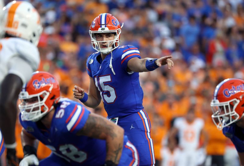 Sep 16, 2023; Gainesville, Florida, USA; Florida Gators quarterback Graham Mertz (15)  points against the Tennessee Volunteers during the first quarter at Ben Hill Griffin Stadium. Mandatory Credit: Kim Klement Neitzel-USA TODAY Sports