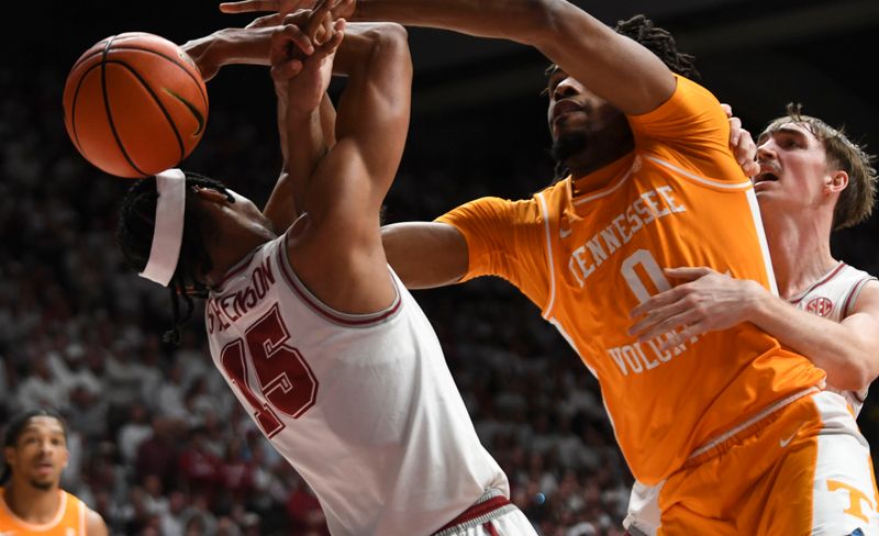 Mar 2, 2024; Tuscaloosa, Alabama, USA;  Alabama forward Jarin Stevenson (15) and Tennessee forward Jonas Aiddo (0) fight for a rebound that gets knocked out of bounds at Coleman Coliseum. Mandatory Credit: Gary Cosby Jr.-USA TODAY Sports