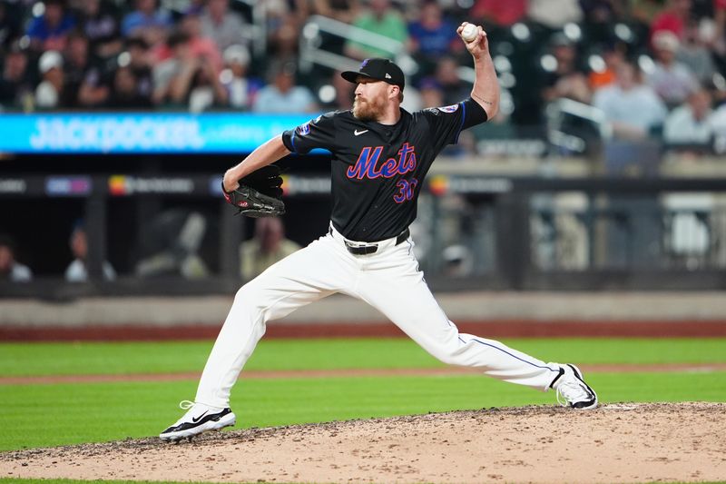 Jul 10, 2024; New York City, New York, USA; New York Mets pitcher Jake Diekman (30) delivers a pitch against the Washington Nationals during the seventh inning at Citi Field. Mandatory Credit: Gregory Fisher-USA TODAY Sports