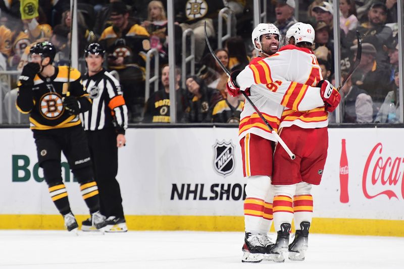 Nov 7, 2024; Boston, Massachusetts, USA;  Calgary Flames center Nazem Kadri (91) is congratulated by center Connor Zary (47) after scoring a goal during the third period against the Boston Bruins at TD Garden. Mandatory Credit: Bob DeChiara-Imagn Images