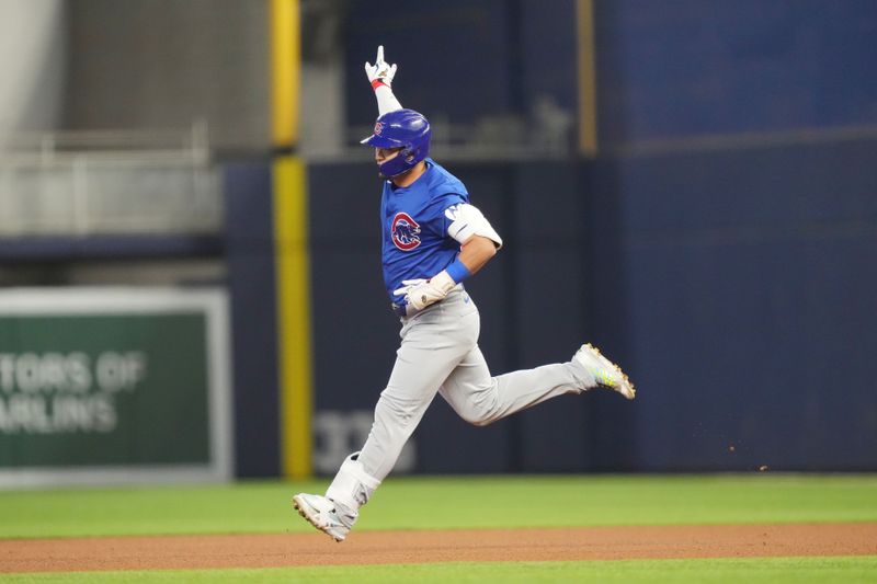 Aug 24, 2024; Miami, Florida, USA;  Chicago Cubs right fielder Seiya Suzuki (27) rounds the bases after hitting a home run in the first inning against the Miami Marlins at loanDepot Park. Mandatory Credit: Jim Rassol-USA TODAY Sports