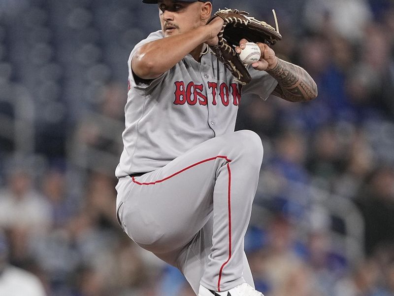 Apr 29, 2025; Toronto, Ontario, CAN; Boston Red Sox pitcher Brennan Bernardino (83) pitches to the Toronto Blue Jays during the ninth inning at Rogers Centre. Mandatory Credit: John E. Sokolowski-Imagn Images