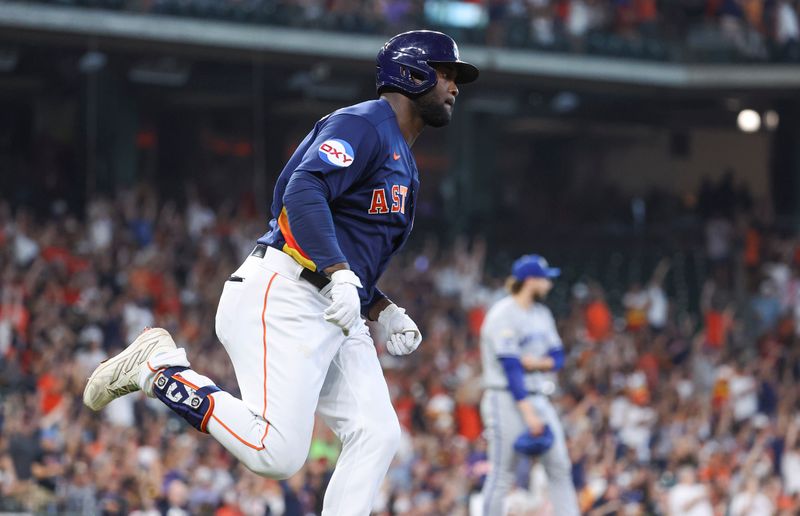 Sep 24, 2023; Houston, Texas, USA; Kansas City Royals relief pitcher Alec Marsh (67) reacts and Houston Astros left fielder Yordan Alvarez (44) rounds the bases after hitting a home run during the fifth inning at Minute Maid Park. Mandatory Credit: Troy Taormina-USA TODAY Sports