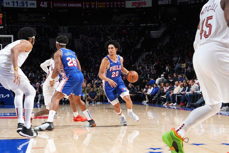 PHILADELPHIA, PA - NOVEMBER 13: Jared McCain #20 of the Philadelphia 76ers drives to the basket during the game against the Cleveland Cavaliers on November 13, 2024 at the Wells Fargo Center in Philadelphia, Pennsylvania NOTE TO USER: User expressly acknowledges and agrees that, by downloading and/or using this Photograph, user is consenting to the terms and conditions of the Getty Images License Agreement. Mandatory Copyright Notice: Copyright 2024 NBAE (Photo by Jesse D. Garrabrant/NBAE via Getty Images)