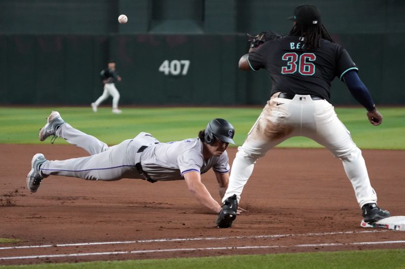 Aug 12, 2024; Phoenix, Arizona, USA; Colorado Rockies first base Michael Toglia (4) gets doubled off firstbase in the ninth inning against the Arizona Diamondbacks at Chase Field. Mandatory Credit: Rick Scuteri-USA TODAY Sports