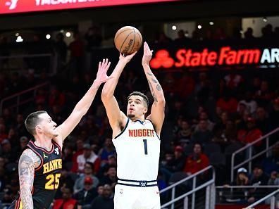 ATLANTA, GA - DECEMBER 11: Michael Porter Jr. #1 of the Denver Nuggets shoots the ball during the game against the Atlanta Hawks on December 11, 2023 at State Farm Arena in Atlanta, Georgia.  NOTE TO USER: User expressly acknowledges and agrees that, by downloading and/or using this Photograph, user is consenting to the terms and conditions of the Getty Images License Agreement. Mandatory Copyright Notice: Copyright 2023 NBAE (Photo by Adam Hagy/NBAE via Getty Images)