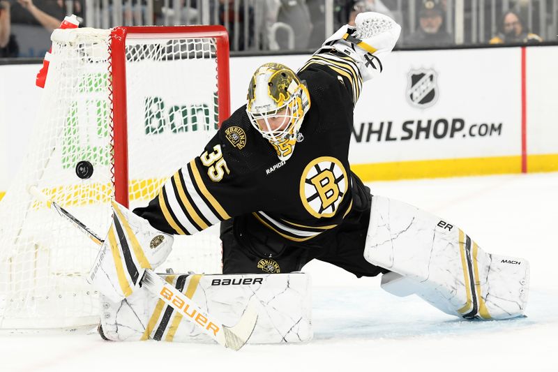 Feb 8, 2024; Boston, Massachusetts, USA; Boston Bruins goaltender Linus Ullmark (35) makes a save during the second period against the Vancouver Canucks at TD Garden. Mandatory Credit: Bob DeChiara-USA TODAY Sports