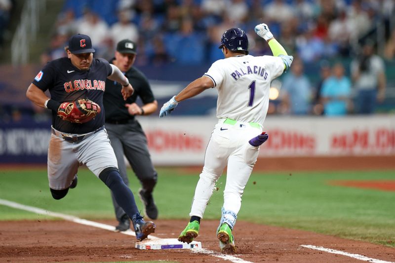 Jul 12, 2024; St. Petersburg, Florida, USA; Cleveland Guardians first baseman Josh Naylor (22) beats Tampa Bay Rays second baseman Richie Palacios (1) to first base for an out in the second inning at Tropicana Field. Mandatory Credit: Nathan Ray Seebeck-USA TODAY Sports