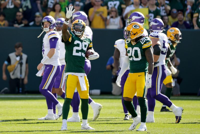 Green Bay Packers safety Xavier McKinney (29) celebrates an interception during the second half of an NFL football game against the Minnesota Vikings, Sunday, Sept. 29, 2024, in Green Bay, Wis. (AP Photo/Mike Roemer)