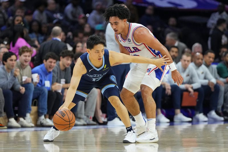 PHILADELPHIA, PENNSYLVANIA - NOVEMBER 2: Yuki Kawamura #17 of the Memphis Grizzlies dribbles the ball against Jared McCain #20 of the Philadelphia 76ers in the second half at the Wells Fargo Center on November 2, 2024 in Philadelphia, Pennsylvania. The Grizzlies defeated the 76ers 124-107. NOTE TO USER: User expressly acknowledges and agrees that, by downloading and/or using this photograph, user is consenting to the terms and conditions of the Getty Images License Agreement. (Photo by Mitchell Leff/Getty Images)