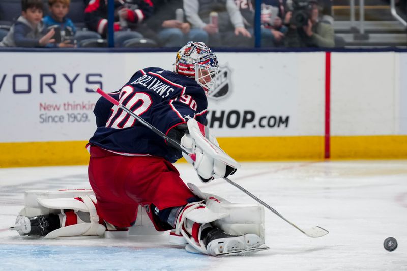 Nov 2, 2023; Columbus, Ohio, USA;  Columbus Blue Jackets goaltender Elvis Merzlikins (90) makes a save in net against the Tampa Bay Lightning in the second period at Nationwide Arena. Mandatory Credit: Aaron Doster-USA TODAY Sports