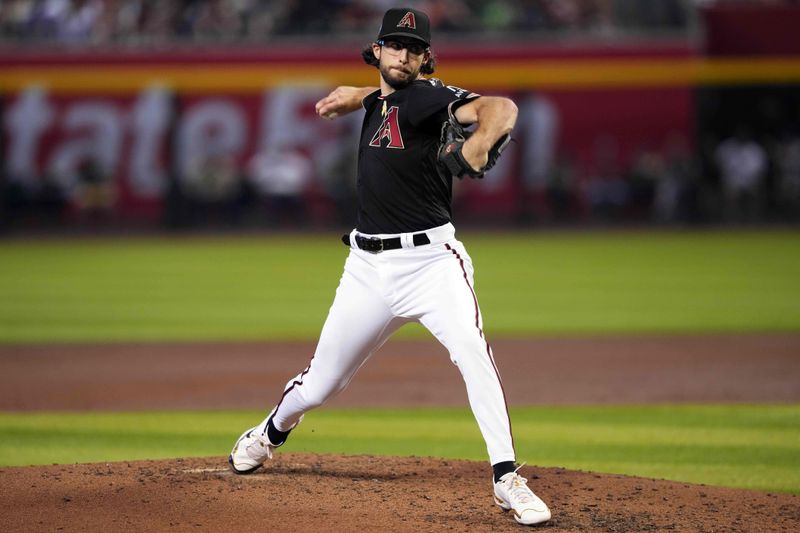 Sep 3, 2023; Phoenix, Arizona, USA; Arizona Diamondbacks starting pitcher Zac Gallen (23) pitches against the Baltimore Orioles during the third inning at Chase Field. Mandatory Credit: Joe Camporeale-USA TODAY Sports