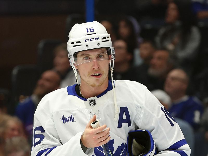 Nov 30, 2024; Tampa, Florida, USA;Toronto Maple Leafs right wing Mitch Marner (16) looks on against the Tampa Bay Lightning during the first period at Amalie Arena. Mandatory Credit: Kim Klement Neitzel-Imagn Images