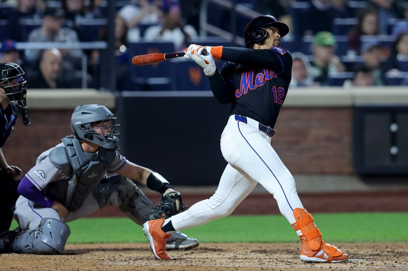 May 30, 2025; New York City, New York, USA; New York Mets shortstop Francisco Lindor (12) follows through on a solo home run against the Colorado Rockies during the eighth inning at Citi Field. Mandatory Credit: Brad Penner-Imagn Images