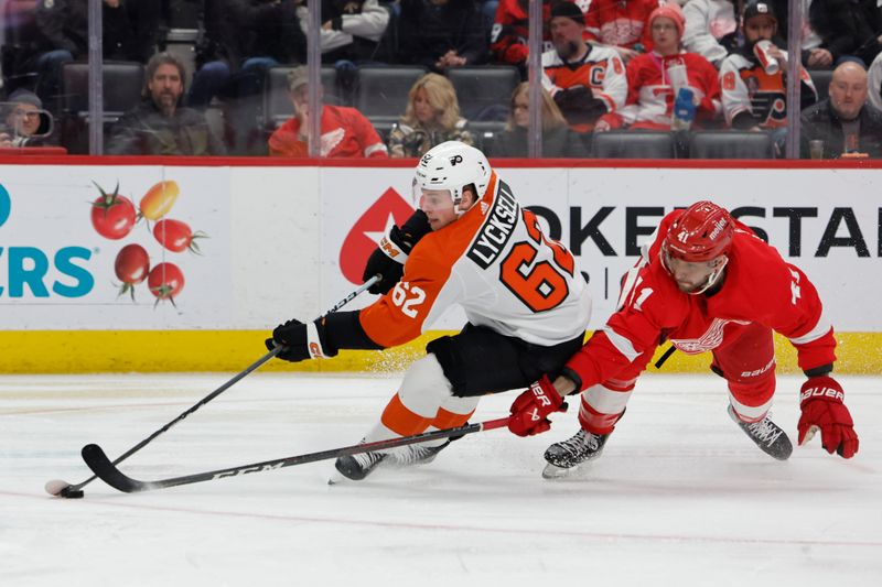 Jan 25, 2024; Detroit, Michigan, USA;  Philadelphia Flyers right wing Olle Lycksell (62) skates with the puck defended by Detroit Red Wings defenseman Shayne Gostisbehere (41) in the third period at Little Caesars Arena. Mandatory Credit: Rick Osentoski-USA TODAY Sports