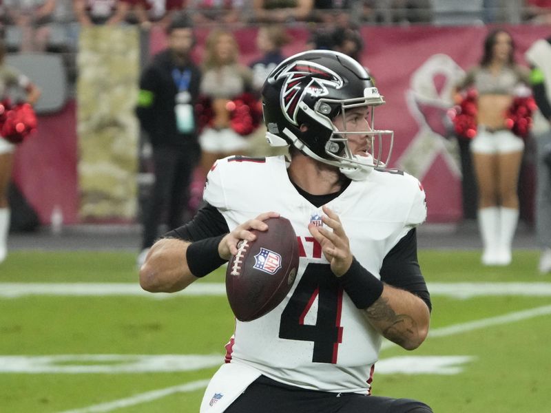 Atlanta Falcons quarterback Taylor Heinicke (4) throws the ball against the Arizona Cardinals during the first half of an NFL football game, Sunday, Nov. 12, 2023, in Glendale, Ariz. (AP Photo/Rick Scuteri)