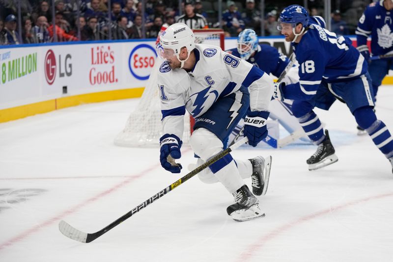 Nov 6, 2023; Toronto, Ontario, CAN; Tampa Bay Lightning forward Steven Stamkos (91) chases the puck against the Toronto Maple Leafs during the second period at Scotiabank Arena. Mandatory Credit: John E. Sokolowski-USA TODAY Sports