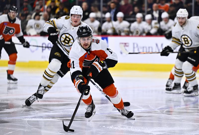 Jan 27, 2024; Philadelphia, Pennsylvania, USA; Philadelphia Flyers right wing Travis Konecny (11) controls the puck against the Boston Bruins in the second period at Wells Fargo Center. Mandatory Credit: Kyle Ross-USA TODAY Sports