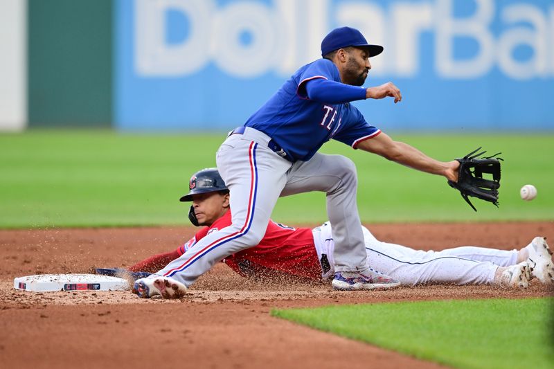 Sep 16, 2023; Cleveland, Ohio, USA; Cleveland Guardians catcher Bo Naylor (23) steals second as Texas Rangers second baseman Marcus Semien (2) waits for the throw during the second inning at Progressive Field. Mandatory Credit: Ken Blaze-USA TODAY Sports